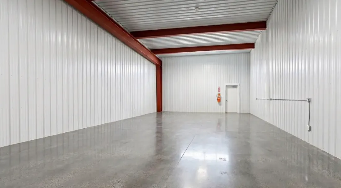 Interior of a 1,500 SF flex bay with a grade-level roll-up door