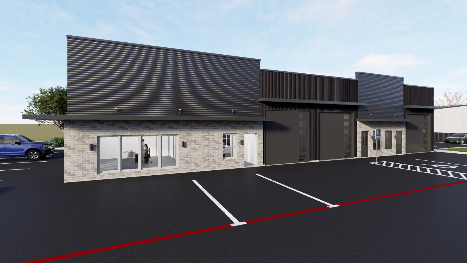 Exterior of a 3,000 SF showroom unit on Building A at Rockwall Flex Park in Rockwall, Texas, with a glass storefront beside grade-level doors where tenant signage mounts