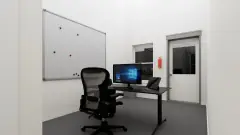 1,500 SF unit office with whiteboard and desk