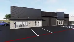 3,000 SF showroom unit exterior on Building A, glass office front beside grade-level doors